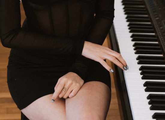 Elegant image representing culture and class on my landing page featuring a girl playing the piano